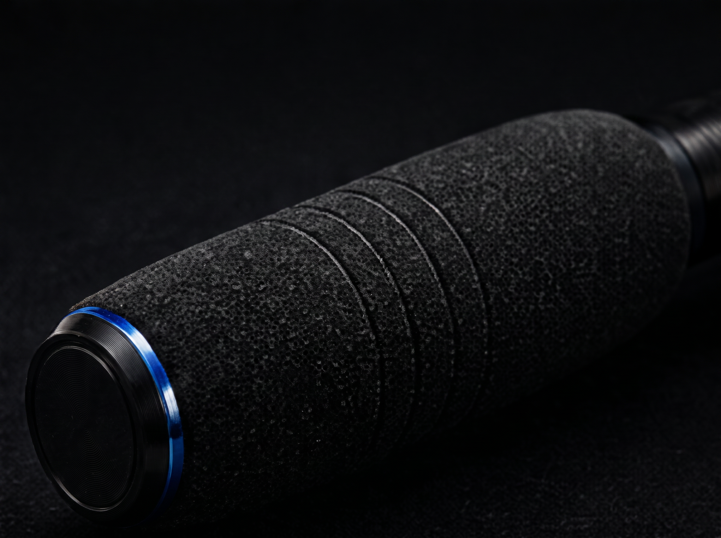 Textured grip with machined end cap and blue anodised ring
